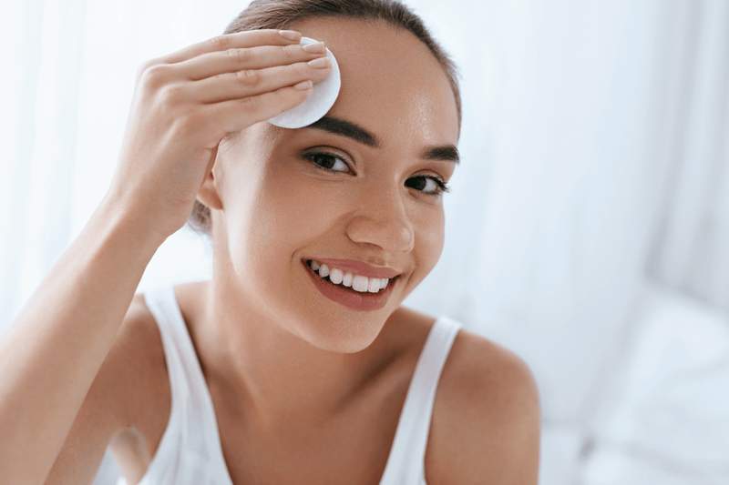 Clean Face. Beautiful Woman Cleaning Facial Skin With White ...smetic Pad, Removing Makeup. Face Skin Care. High Resolution